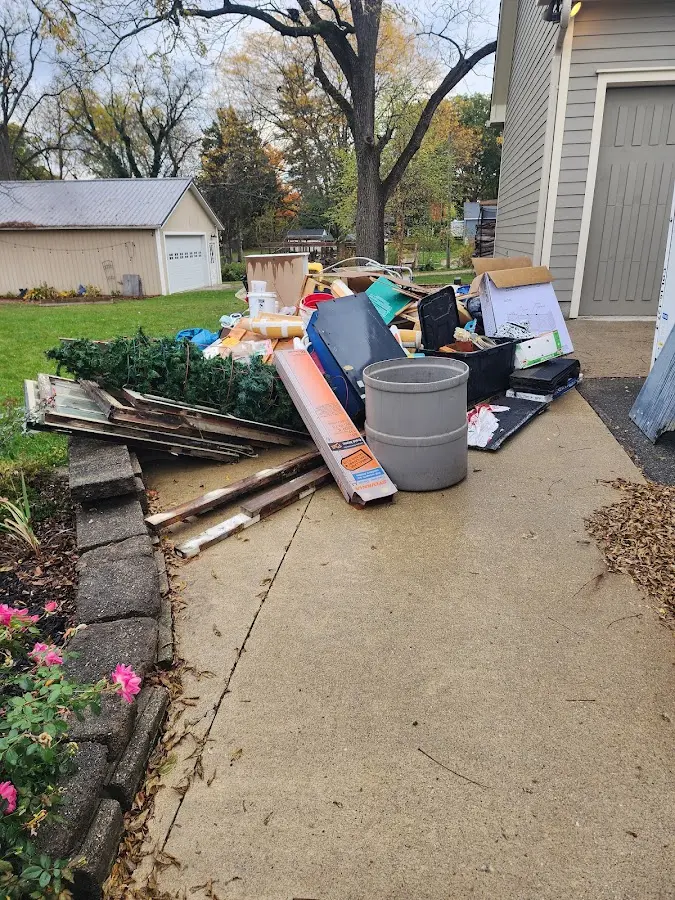 Dumpster being loaded with debris for Commercial Dumpster Rental in Jacinto City